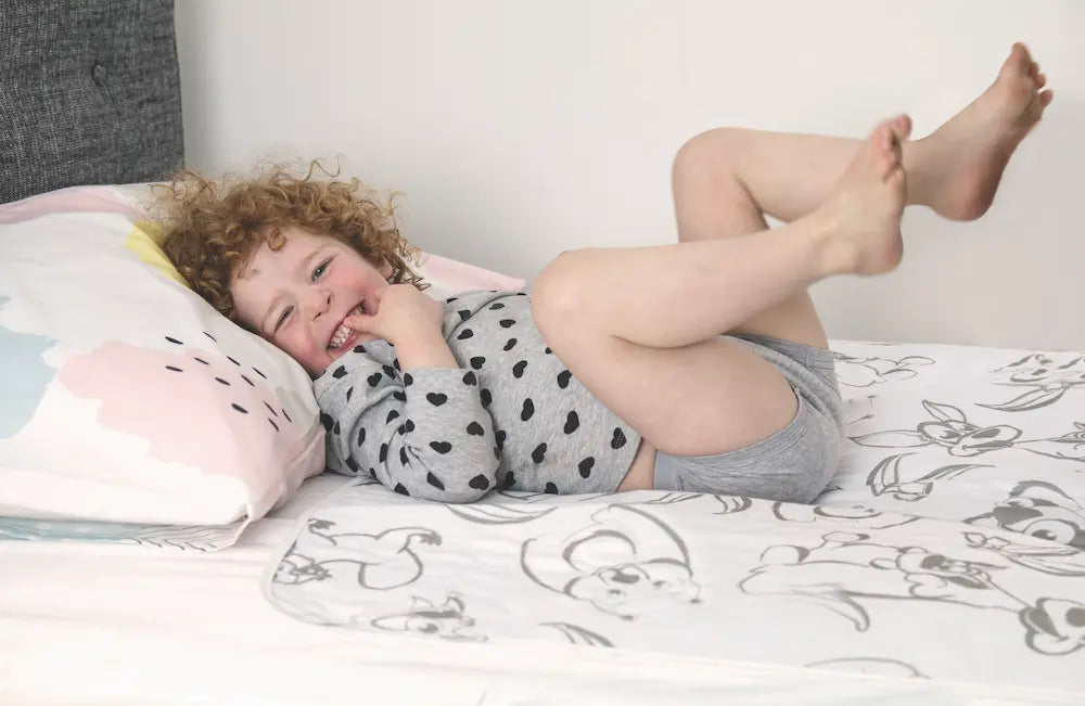 bedwetting in children child on bed