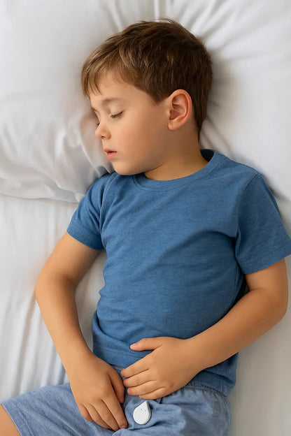 Boy with bed wetting alarm